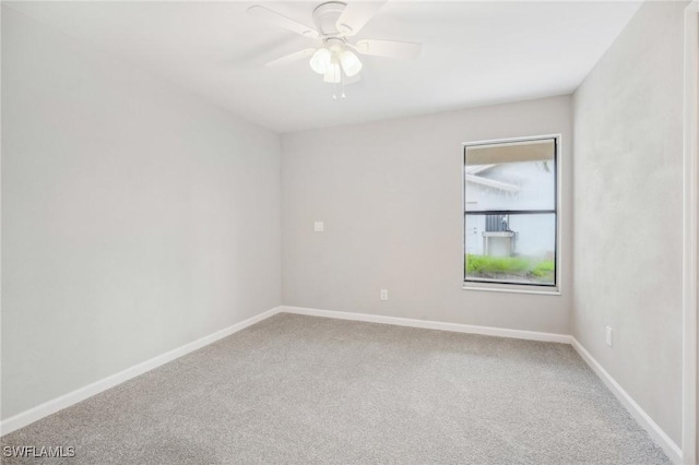 empty room with ceiling fan and carpet