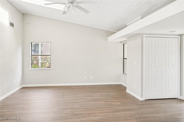 unfurnished room with ceiling fan, wood ceiling, and light hardwood / wood-style flooring