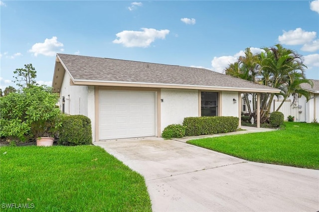 view of front facade with a garage and a front yard