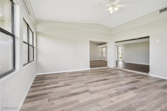 unfurnished room featuring wood-type flooring, lofted ceiling, and ceiling fan