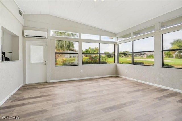 unfurnished sunroom with wood ceiling, a wall mounted AC, and vaulted ceiling