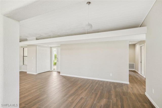 spare room featuring dark hardwood / wood-style floors