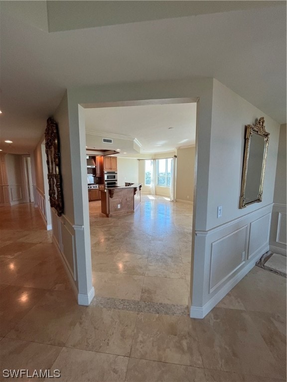 hallway featuring light tile floors