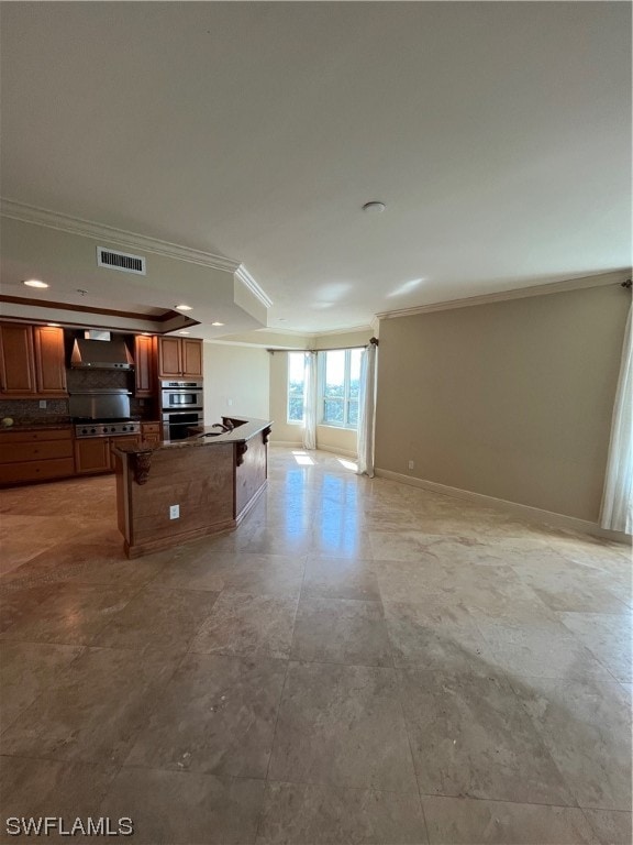 interior space with backsplash, light tile flooring, a kitchen breakfast bar, stainless steel appliances, and crown molding