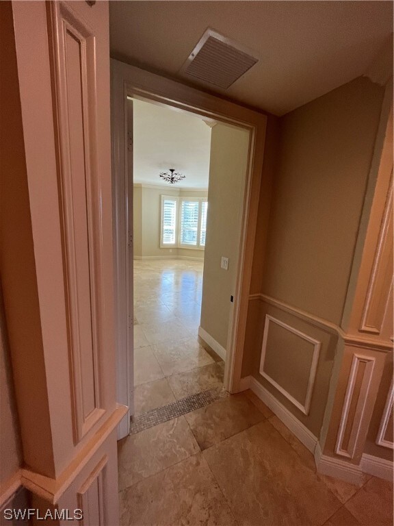 hall with light tile flooring