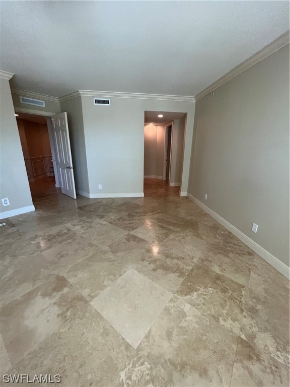 unfurnished room with tile floors and crown molding