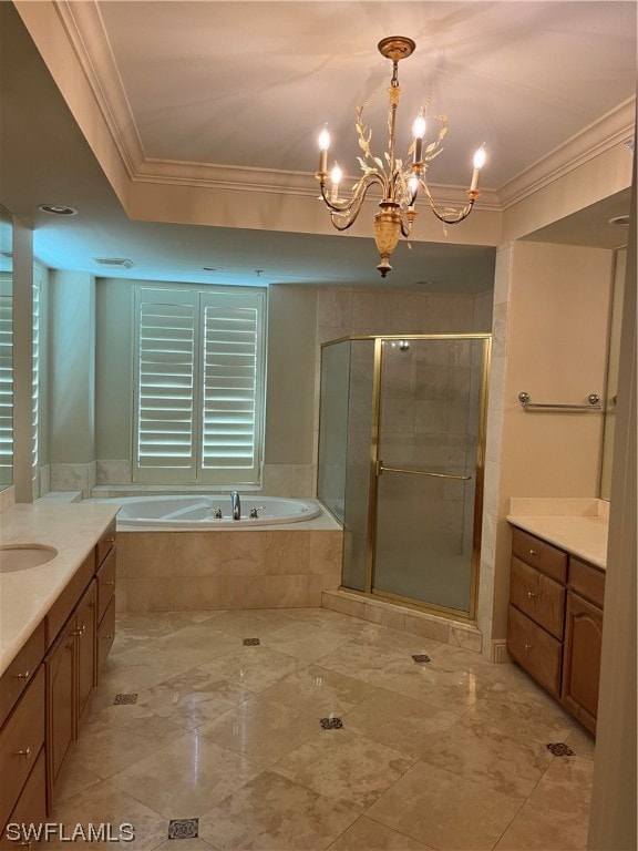 bathroom with ornamental molding, a notable chandelier, and vanity