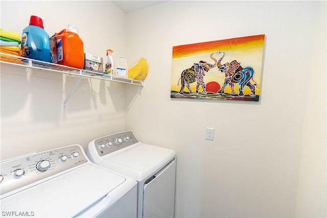 laundry area with washing machine and dryer