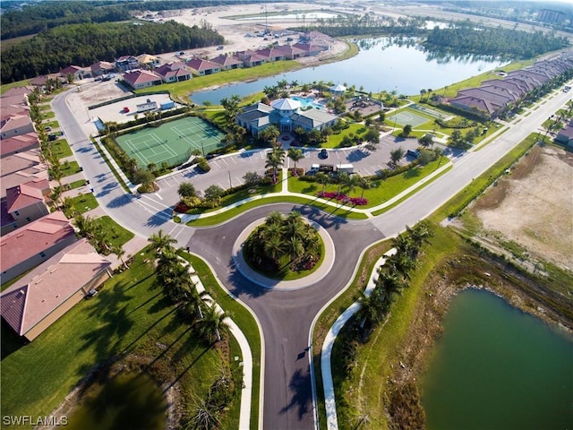 birds eye view of property with a water view and a residential view