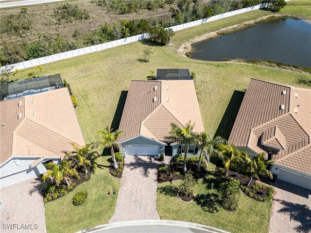 birds eye view of property with a water view