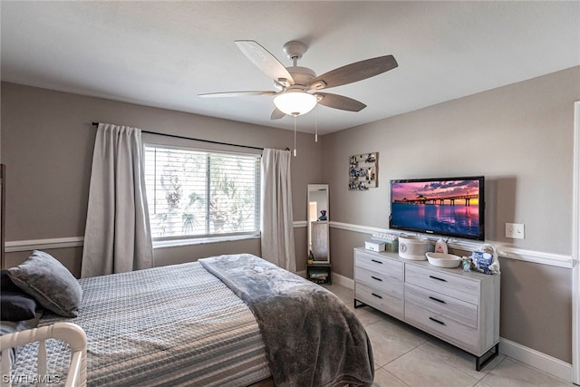 bedroom featuring ceiling fan and light tile patterned floors