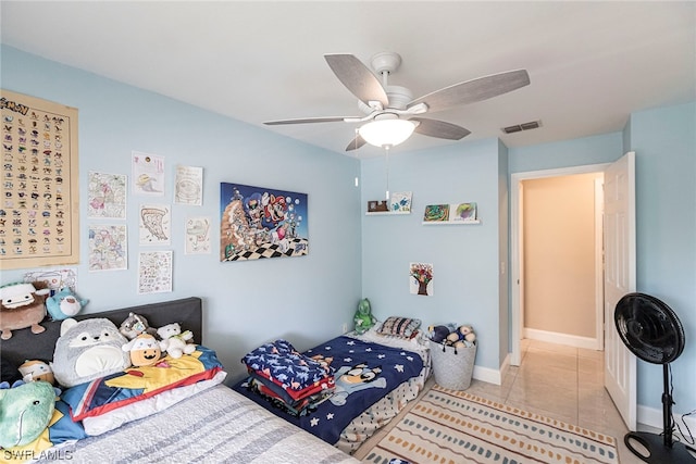 tiled bedroom with ceiling fan