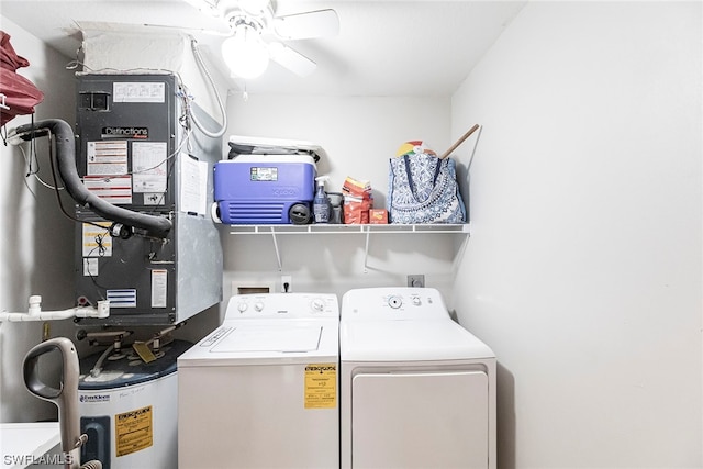 clothes washing area with washing machine and clothes dryer, heating unit, ceiling fan, and water heater