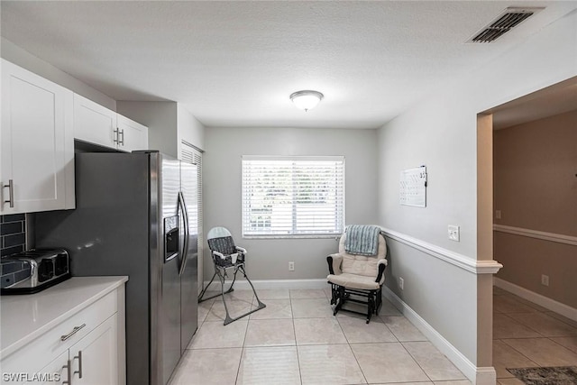 interior space with light tile patterned flooring