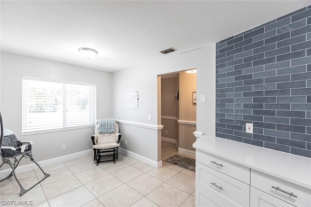 living area featuring light tile patterned floors