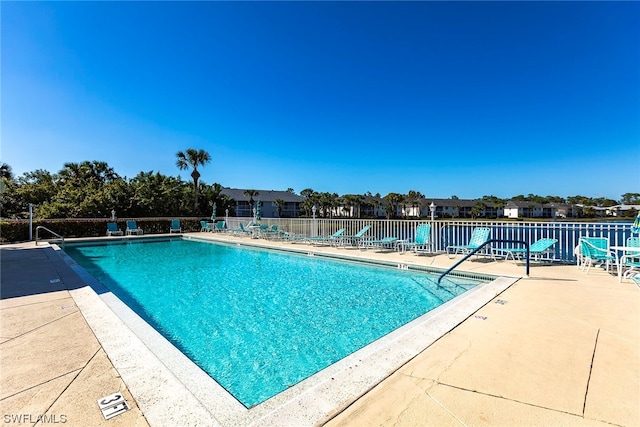 view of pool featuring a patio