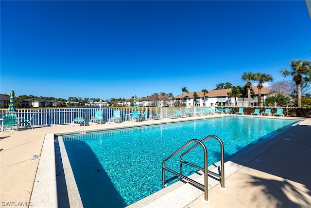 view of swimming pool with a patio