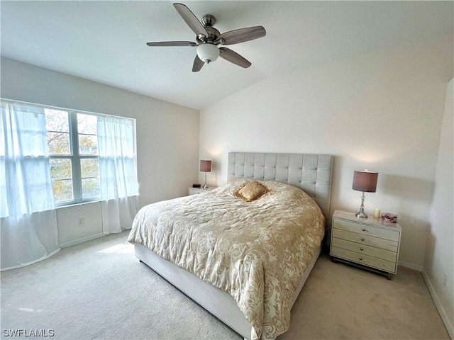 carpeted bedroom with lofted ceiling and ceiling fan