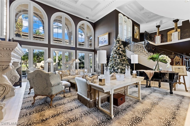 living room featuring tile patterned floors, a towering ceiling, crown molding, and french doors