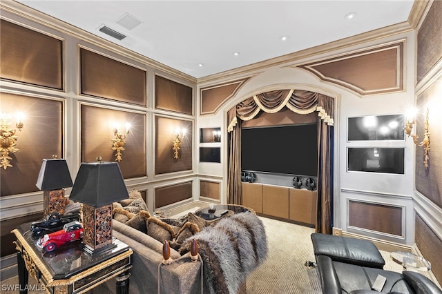 carpeted home theater with crown molding