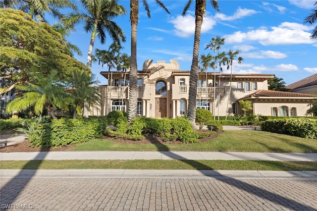 view of front of property with a balcony