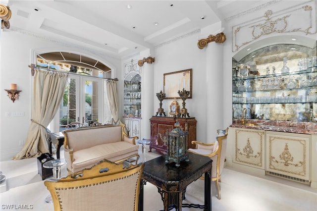 living area featuring french doors, indoor bar, and crown molding