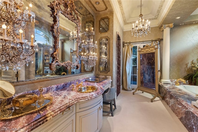 bathroom with a tub to relax in, ornate columns, vanity, and ornamental molding