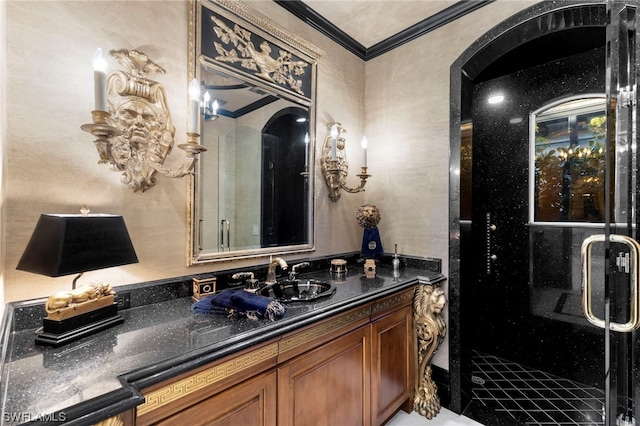 bathroom featuring vanity, ornamental molding, and walk in shower