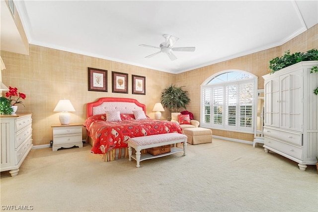 bedroom featuring light carpet, ceiling fan, and crown molding