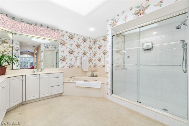 bathroom featuring independent shower and bath and vanity