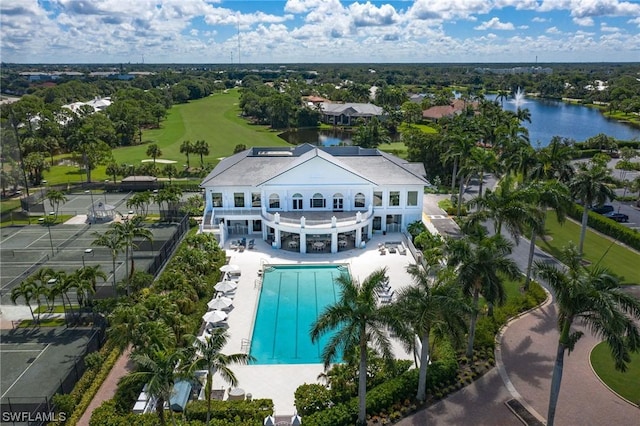 birds eye view of property with a water view