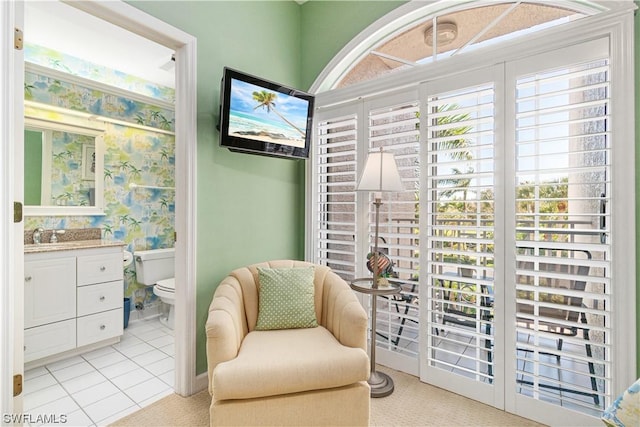 sitting room featuring light tile patterned floors