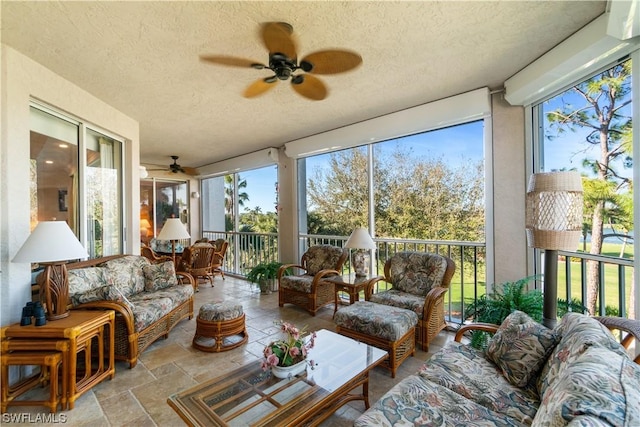 sunroom / solarium with ceiling fan and a wealth of natural light