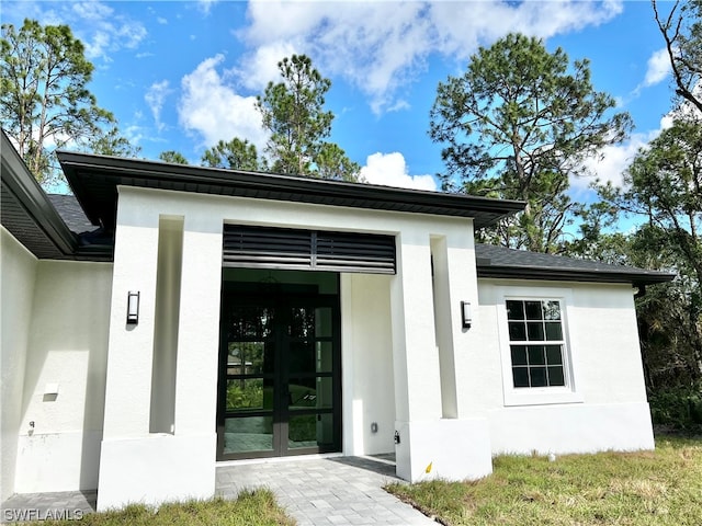 property entrance featuring french doors