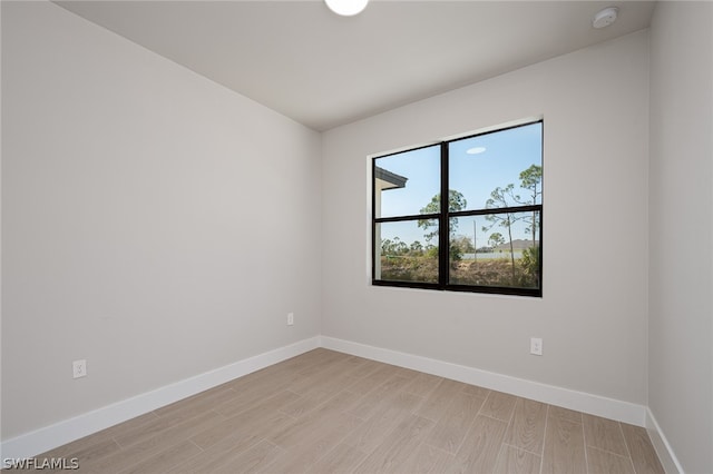 unfurnished room featuring light hardwood / wood-style flooring