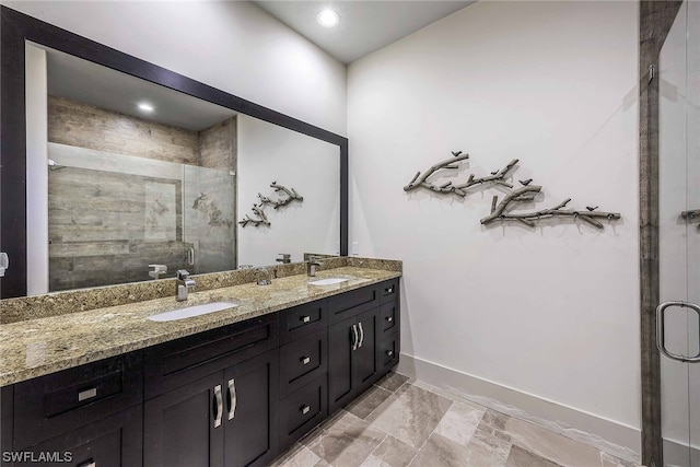 bathroom featuring an enclosed shower, double sink vanity, and tile flooring