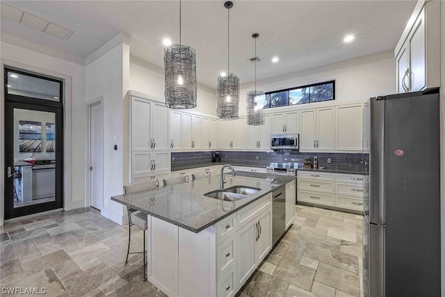 kitchen with white cabinetry, an island with sink, appliances with stainless steel finishes, and sink