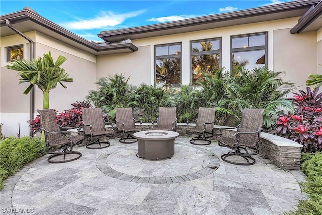 view of patio / terrace with a fire pit