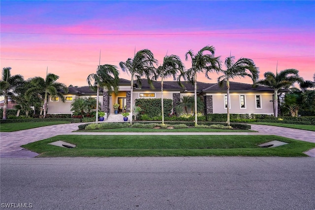 view of front of home featuring a yard