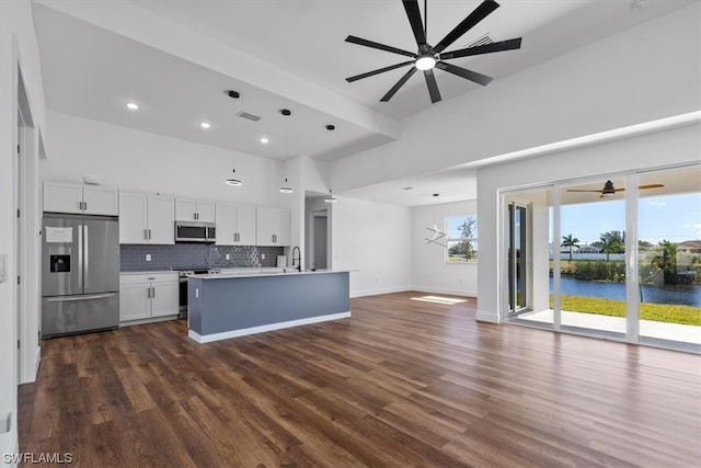 kitchen featuring white cabinets, appliances with stainless steel finishes, decorative light fixtures, and ceiling fan