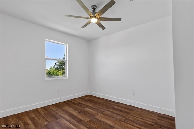 empty room featuring dark hardwood / wood-style floors and ceiling fan