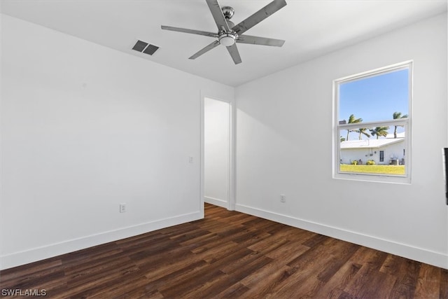 spare room featuring ceiling fan and dark hardwood / wood-style flooring