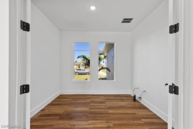 empty room featuring dark hardwood / wood-style floors