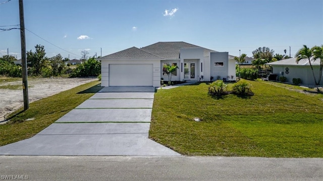 view of front facade with a front yard and a garage