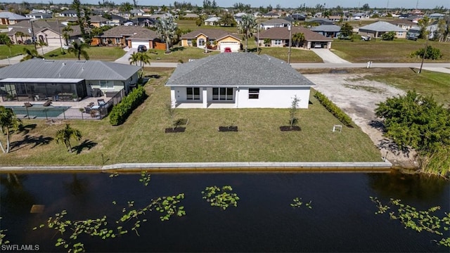 drone / aerial view with a water view