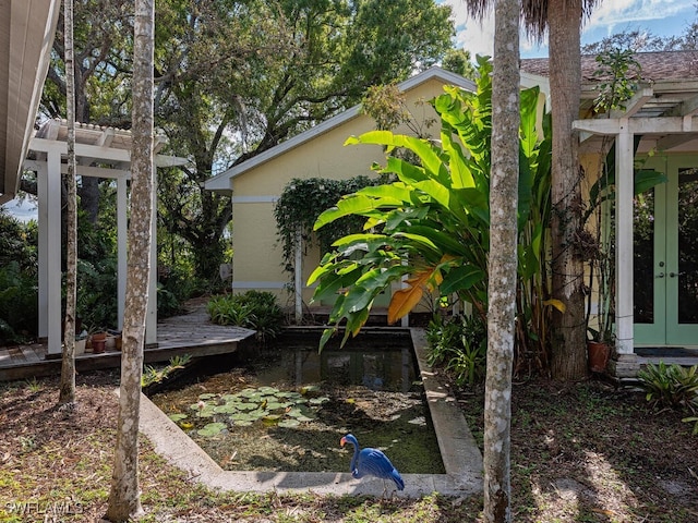 view of yard with french doors