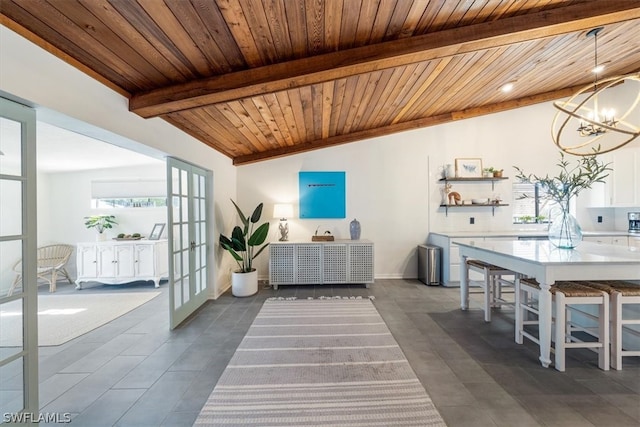 interior space featuring a chandelier, french doors, wood ceiling, and vaulted ceiling with beams