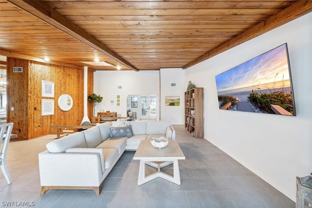 tiled living room featuring wooden ceiling and beamed ceiling