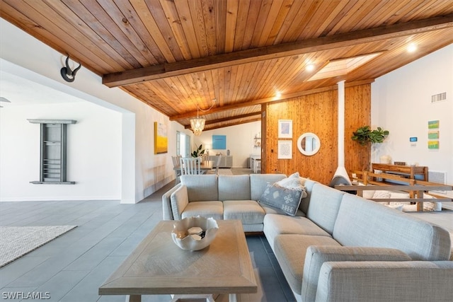 living room with vaulted ceiling with beams and wood ceiling