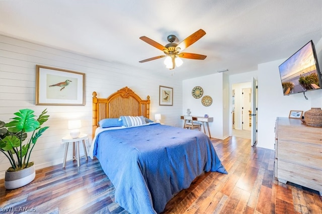 bedroom featuring dark wood-type flooring and ceiling fan